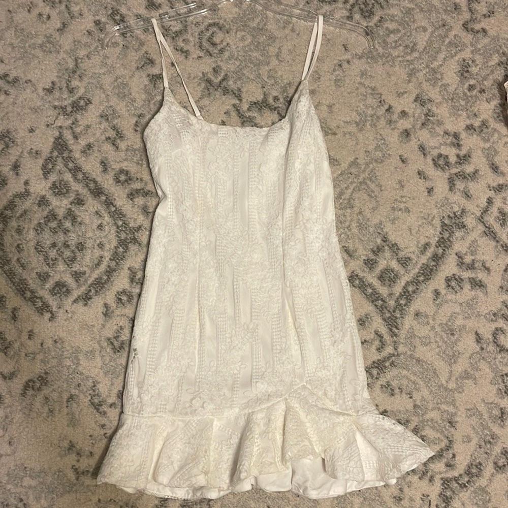 White lace dress with ruffles